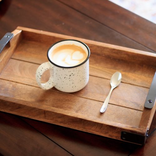 white ceramic mug on brown wooden serving tray
